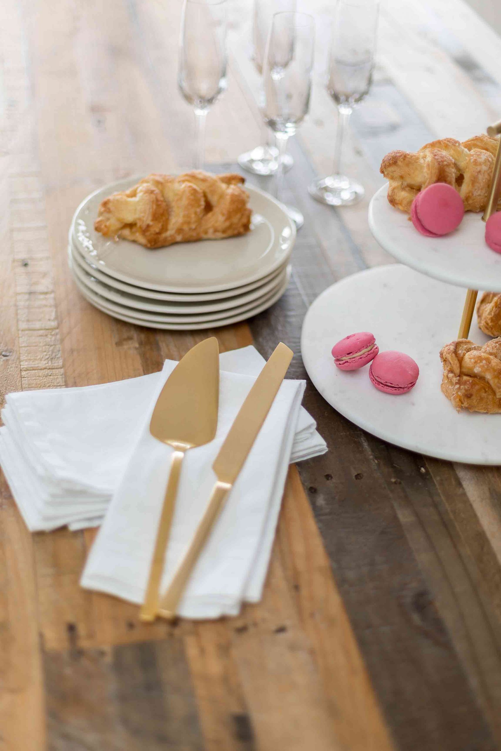 Rustic table with pastries and macaroons
